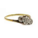 A three stone diamond crossover ring,