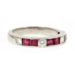 A ruby and diamond half eternity ring,