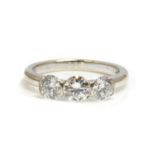 A three stone diamond ring by Theo Fennell,
