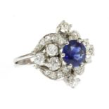 A white gold sapphire and diamond lozenge-shaped cluster ring,