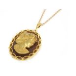 A 9ct gold diamond set profile or cameo habillé-style agate pendant, c.1970,