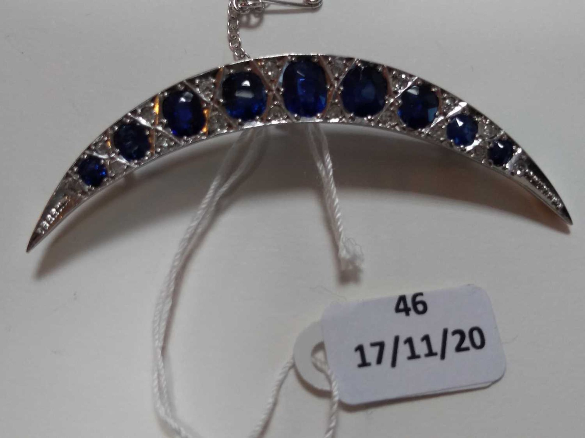 An Edwardian sapphire and diamond crescent brooch, c.1910, - Image 2 of 3