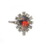 A black opal and diamond pear-shaped cluster ring,