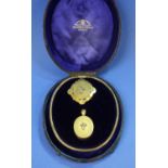 A cased Victorian gold diamond set locket, chain and brooch suite, by Bracher and Sydenham, Reading,