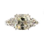 An 18ct white gold three stone diamond ring,