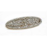 A Belle Époque diamond set oval plaque brooch,