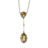 An Art Deco topaz and diamond Edna May pendant, c.1925,