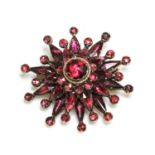 A garnet set star brooch/pendant, c.1800,