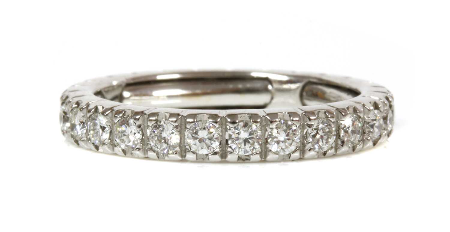 A white gold diamond set full eternity ring,