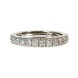 A white gold diamond set full eternity ring,