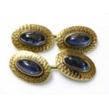 A pair of gold sapphire set cufflinks,