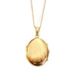 A Finnish 18ct gold oval hinged locket,