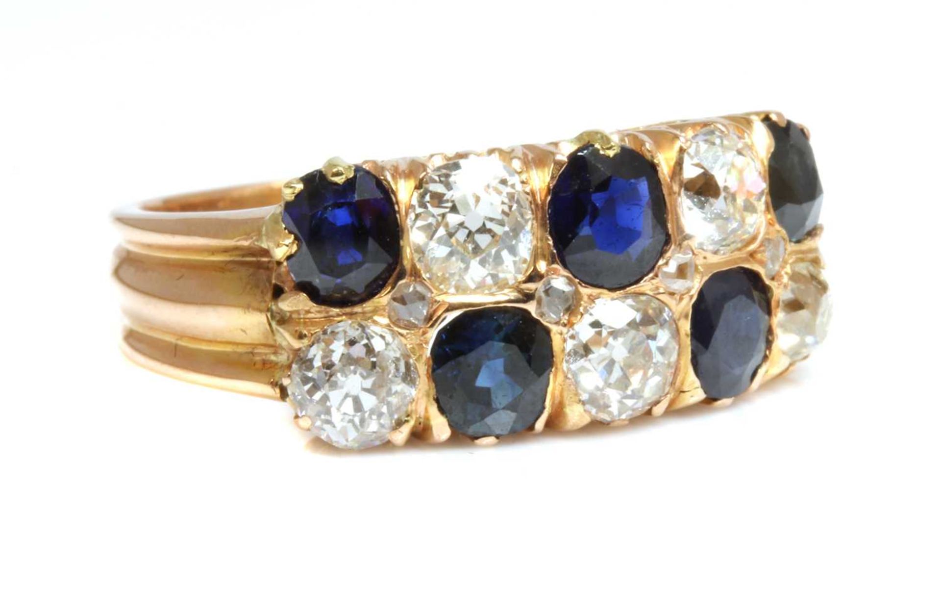 A rose gold two row sapphire and diamond ring, c.1910,