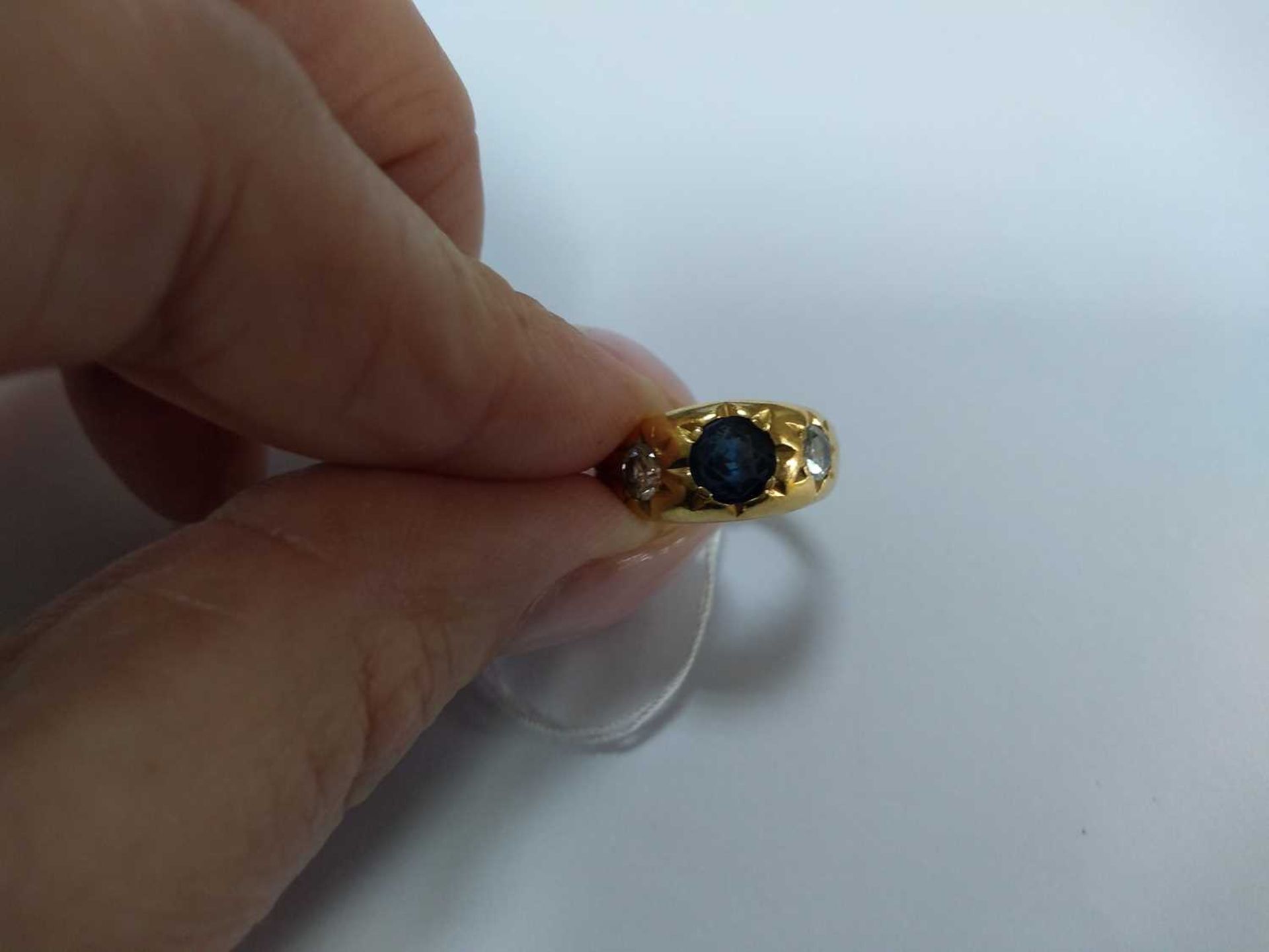 A three stone sapphire and diamond gypsy ring, - Image 4 of 4