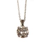 A platinum single stone diamond pendant,