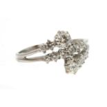 An Italian white gold diamond set crossover ring,