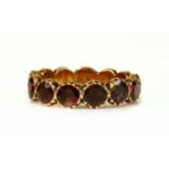 A Georgian foil-backed flat cut garnet eternity-style ring,