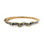 A sapphire and diamond hinged bangle,