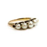 An Edwardian gold five stone pearl ring,