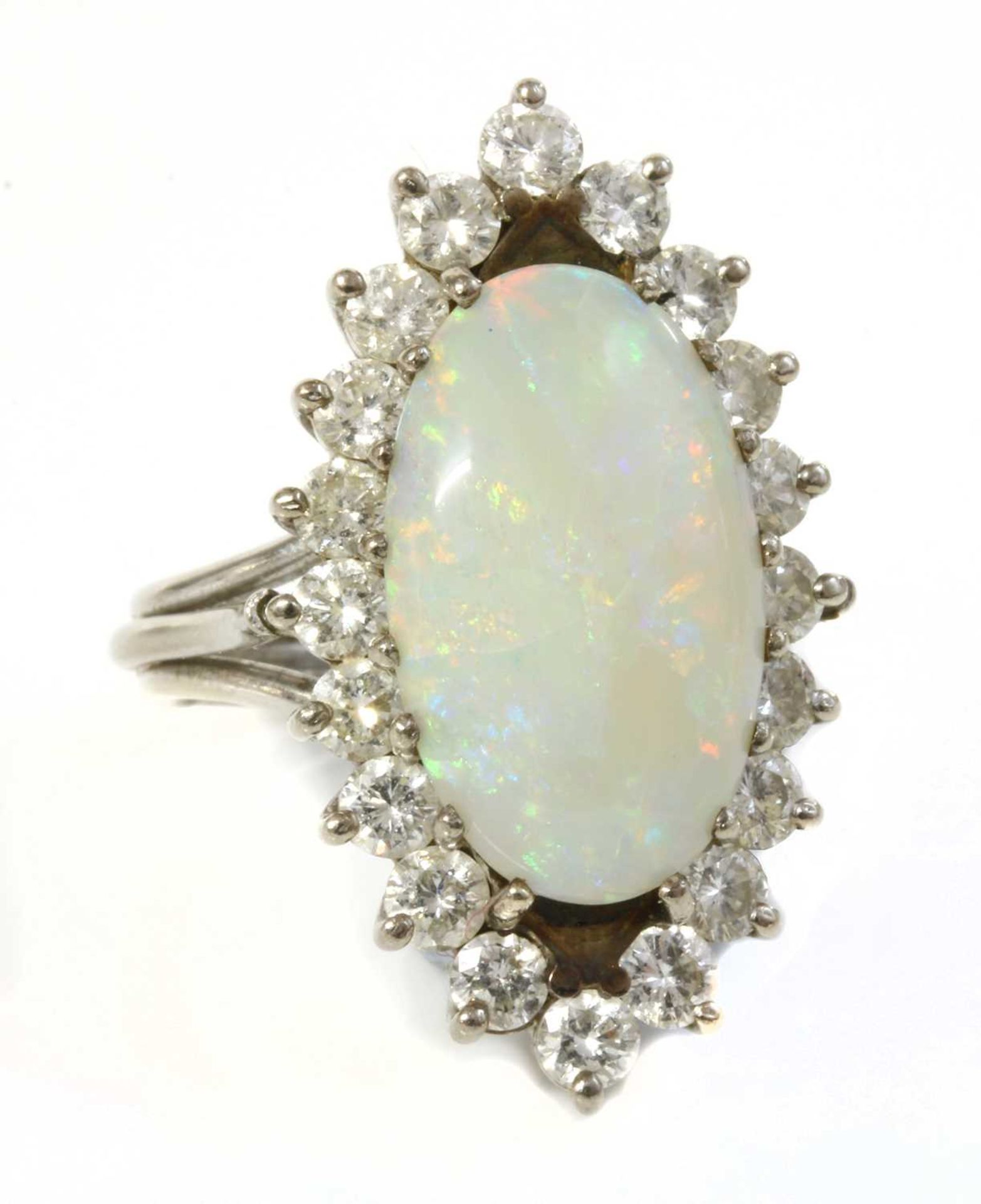 A white gold opal and diamond marquise-shaped cluster ring,
