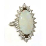 A white gold opal and diamond marquise-shaped cluster ring,