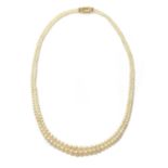 A cased two row graduated natural pearl necklace,