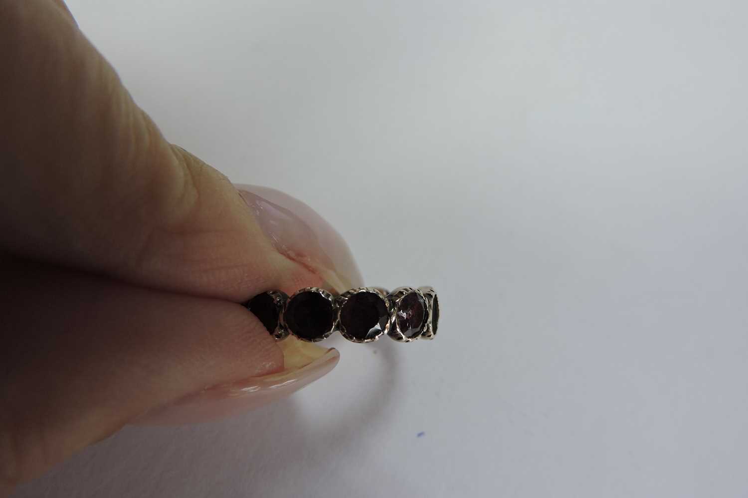 A Georgian foil-backed flat cut garnet eternity-style ring, - Image 7 of 7