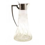 An Edwardian cut glass and silver marked claret jug,
