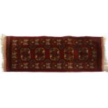 A hand knotted Afghan rug,