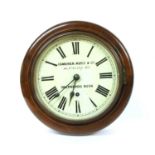 A mahogany wall clock