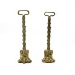 A pair of 19th century brass lion's paw doorstops,