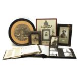 A quantity of framed WWI photographs of soldiers and fretwork search light scene,