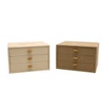 A cream linen covered three drawer 'Bijoux' jewellery box with wood toggle handles,