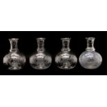 A set of four cut and engraved carafes of globular form,