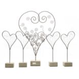 A pair of modern silvered wire heart sculptures and a larger heart sculpture (5)