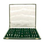 A cased collection of button hooks with various handles,