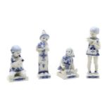 A collection of four Royal Copenhagen blue and white porcelain figures,