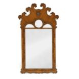 A George III walnut fret carved pier mirror,