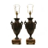 A pair of French bronzed spelter urn table lamps,