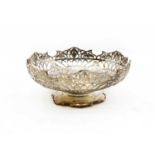 A silver bread basket of circular form,