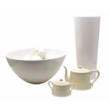A large plain white ceramic bowl, a pedestal bowl of chins fruit a Lilly vase, tea pot and sucrier