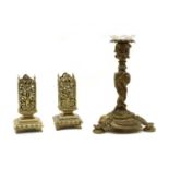 A Rococo design bronze candlestick,