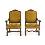 A pair of French walnut throne chairs,