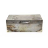 An Art Deco silver cigarette box by Walker & Hall,