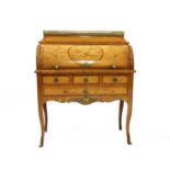 A French Louise XV-style satinwood, kingwood, and marquetry inlaid cylinder bureau,