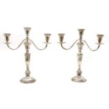 A pair of Kentshire sterling weighted candelabra/candlesticks,