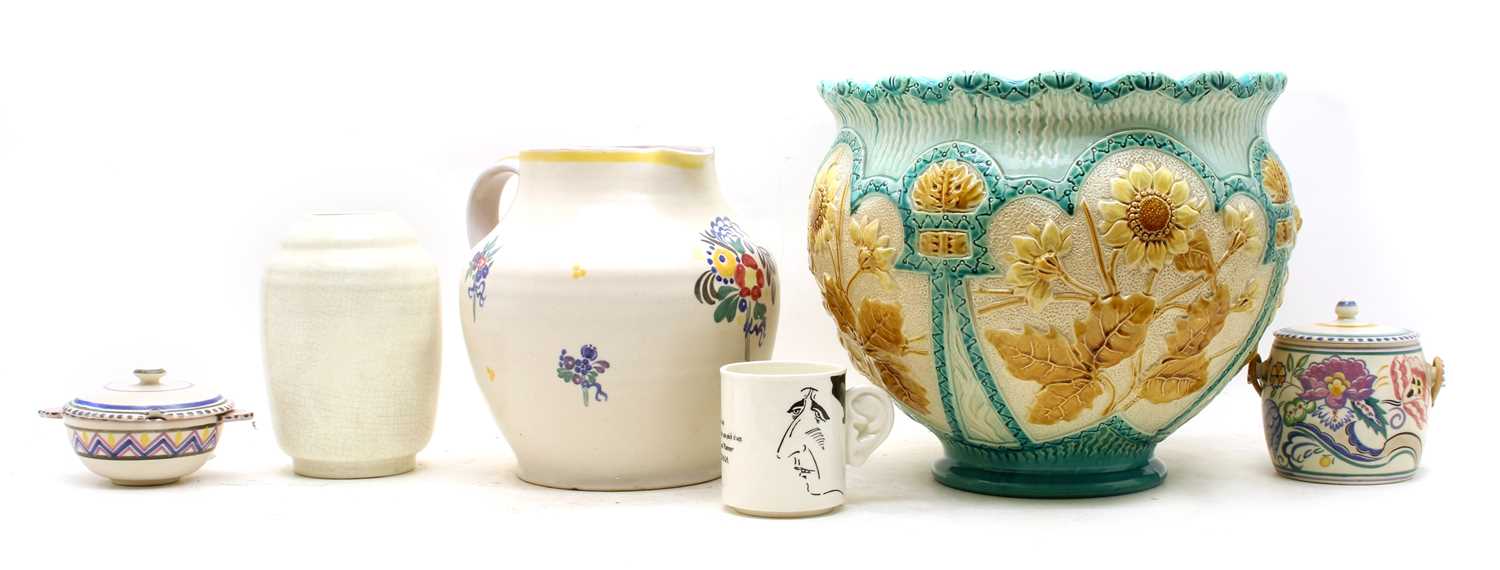 A collection of Poole Pottery comprising of a jug with flowerhead detail,