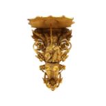 A carved giltwood wall bracket,