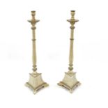 A pair of painted Dutch style altar candlesticks,