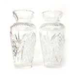 A pair of cut-glass and moulded baluster vases